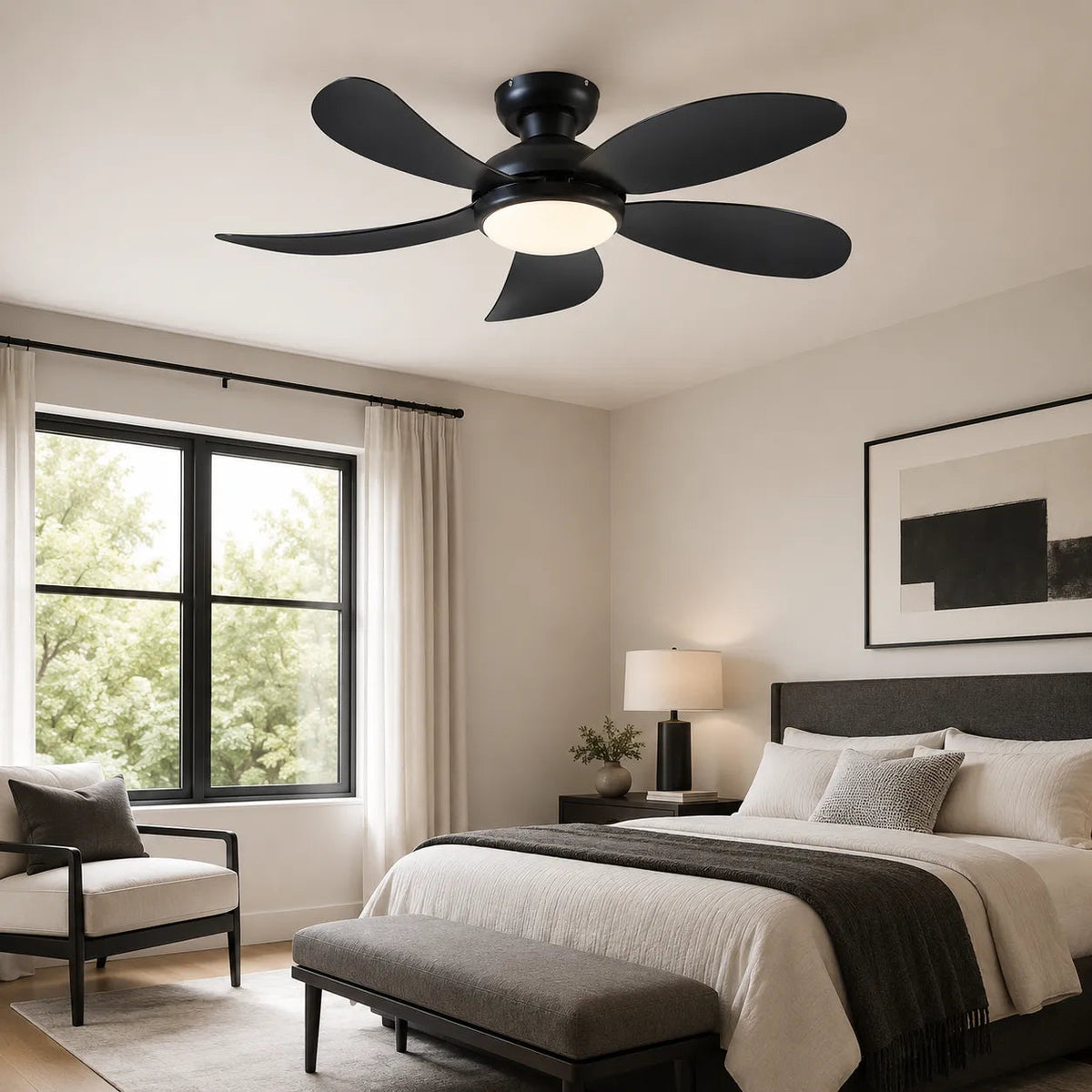 Black 42 inch flush mount ceiling fan with light installed in a modern bedroom